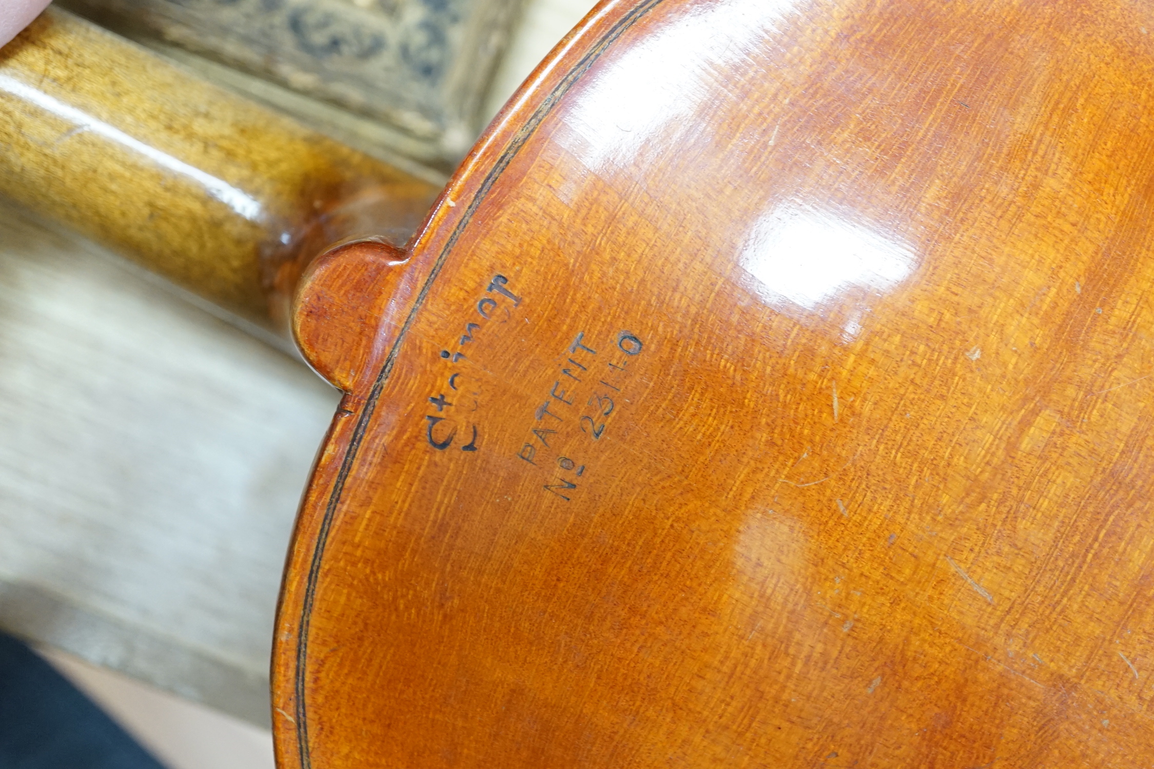 An early 20th century Stainer violin, patent number 23140, back measures 36.5cm excl button. cased